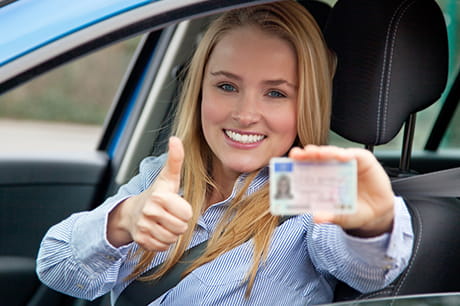 Happy female showing donor card