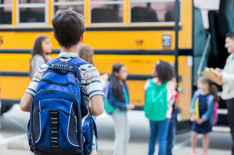 Children getting on a school bus
