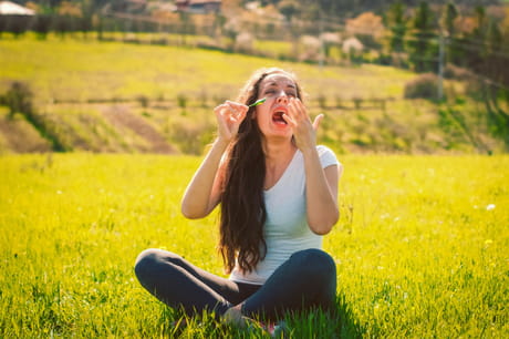 Woman reacting to swallowing a bug