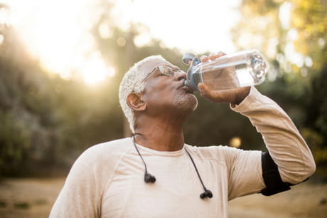Man drinking from water bottle.