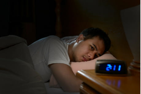 Man having trouble sleeping