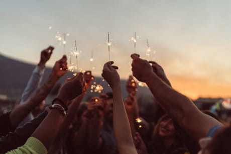 Group of people holding up sparklers