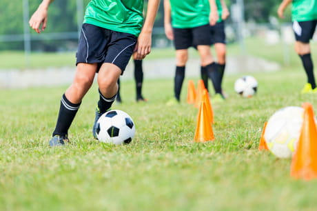 Soccer playing doing a drill