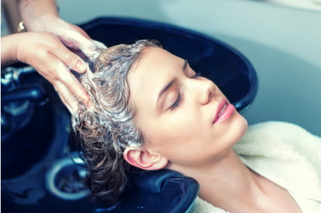 Woman having her hair washed at a salon.