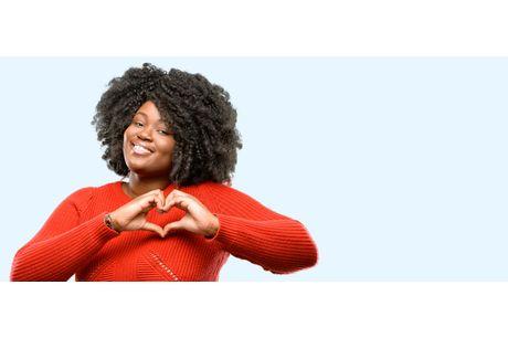 Woman holding heart with her hands. Stay heart healthy with Geisinger