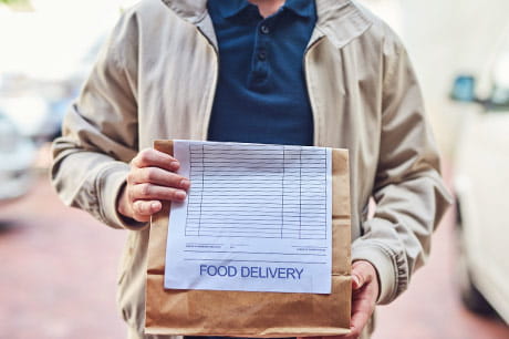 Delivery person with food order