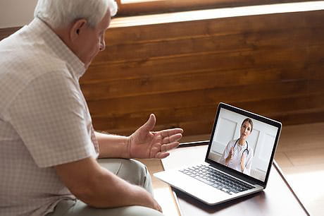 Male patient on a telemedicine call with physician