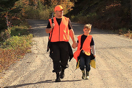 Father and young son spend the day hunting for deer.