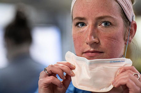 Female health care worker with mask on 