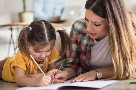 Mother and daughter drawing together