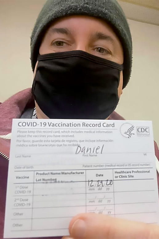 Dan receives his first COVID vaccination shot.
