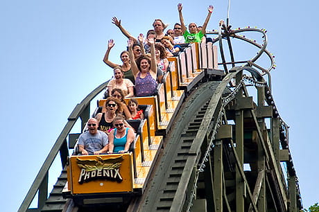 Thrill-seekers enjoy a ride on the Phoenix wooden rollercoaster at Knoebels in Elysburg, Pa.