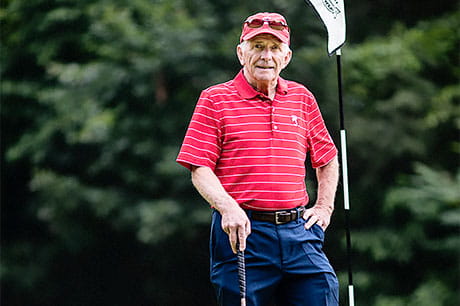 Harry Gaughan stands on the green at a local golf course.