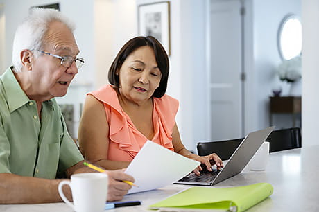Older couple reviewing their Medicare plan options.