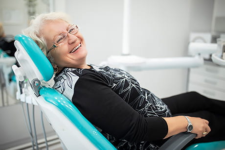 A female patient waits for the dentist to begin her appointment.