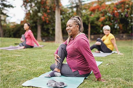 Woman in park doing yoga