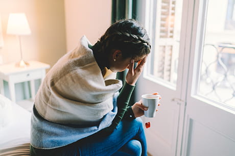 Woman sick drinking tea