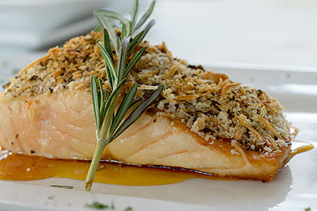 A prepared serving of walnut-and-pistachio-crusted ginger salmon.