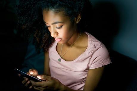 Teenager on her cellphone