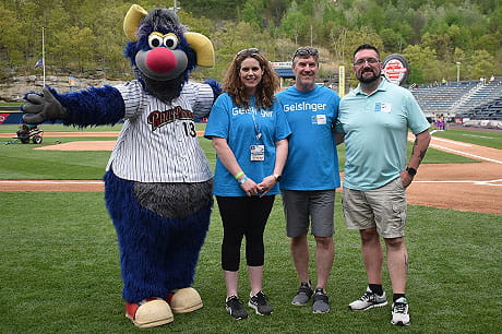 Bariatric surgery patients Elizabeth Royer (second from left) and Bradley Hare (far right) join surgeon Anthony Petrick, MD, and RailRiders mascot Champ at a celebration of the bariatric surgery program’s 20th anniversary. Photo by Kirsten Peters.