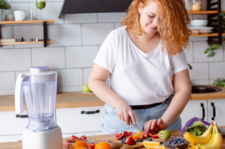 Woman chopping up fruit