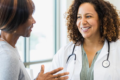 A woman talking to her doctor