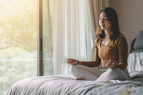 A woman using the benefits of meditation