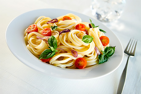 One-pot pasta made with linguini and cherry tomatoes, garlic, and onion.