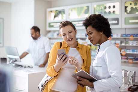 A pregnant woman at a pharmacy