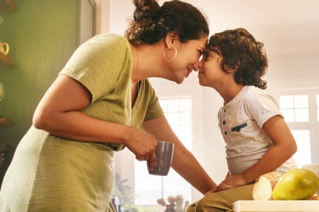 Woman looking at a child with positive vibes 