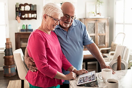 Kathy and Bernard Lahr of Milton, Pa. look at photos on an tablet device.