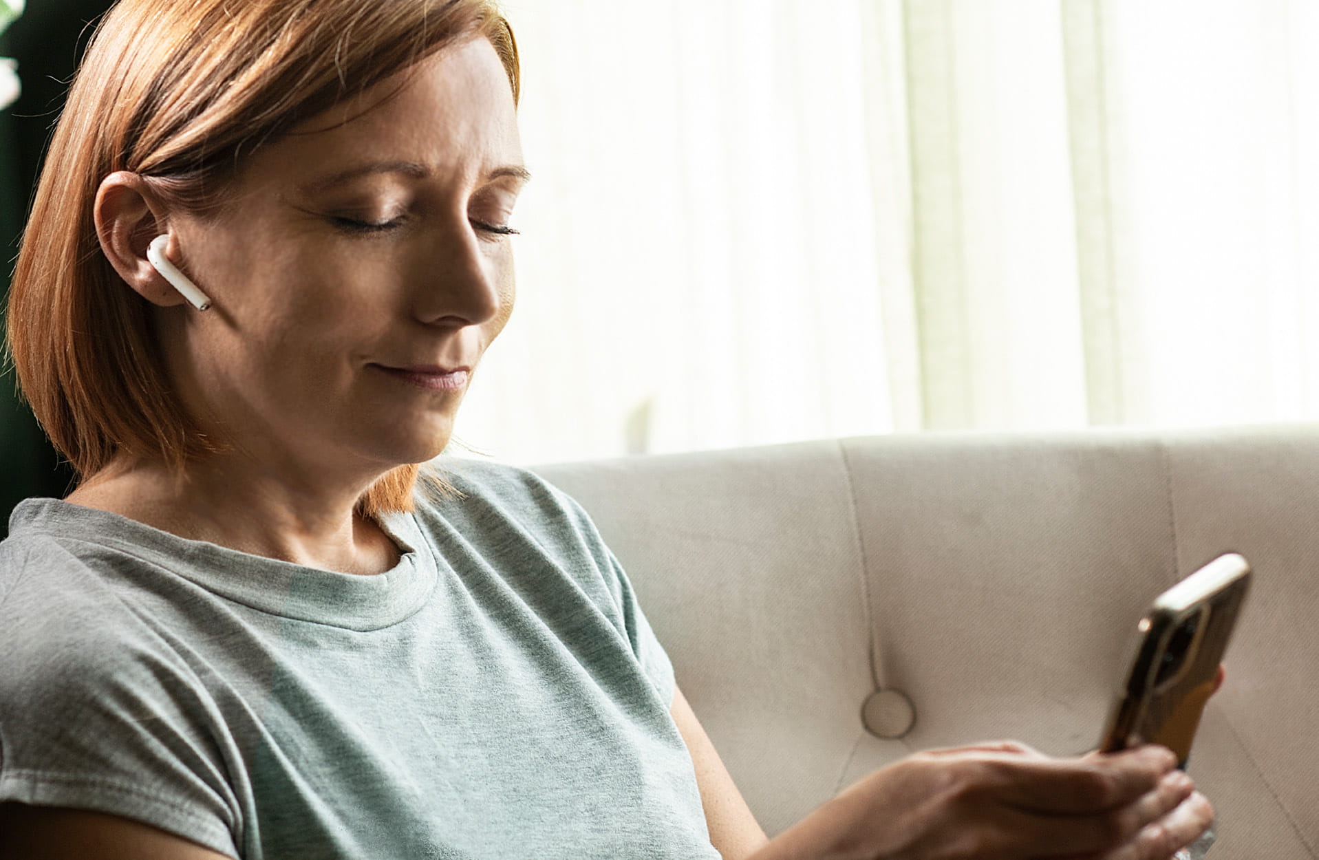 A woman learning about pharmacy misinformation on her phone