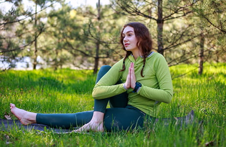 Girl doing yoga with chronic inflammation