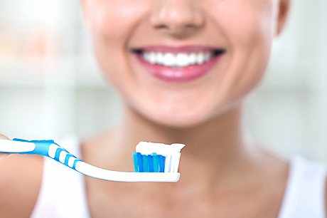 Woman brushing her teeth