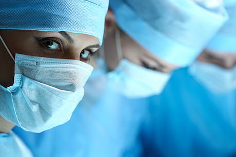 Three doctors with surgical masks on