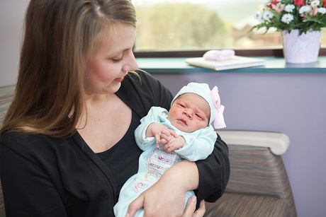 Mother holds newborn