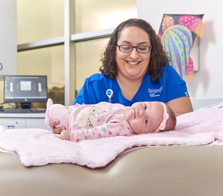 Nurse holds baby