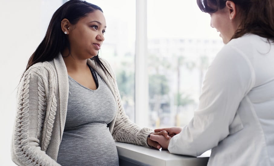 A woman receiving genetic testing during pregnancy