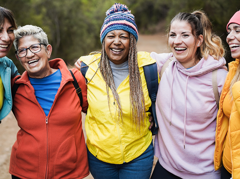 A group of smiling women outdoors