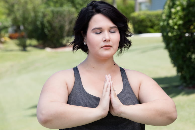overweight woman doing yoga