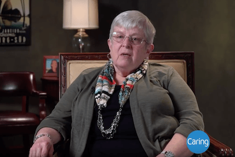 older woman sitting in office chair