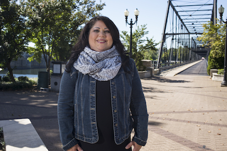 woman standing in front of bridge