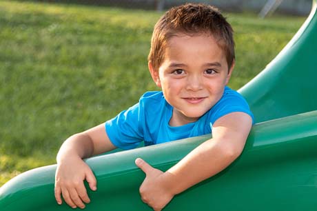 Noah at the park on a slide