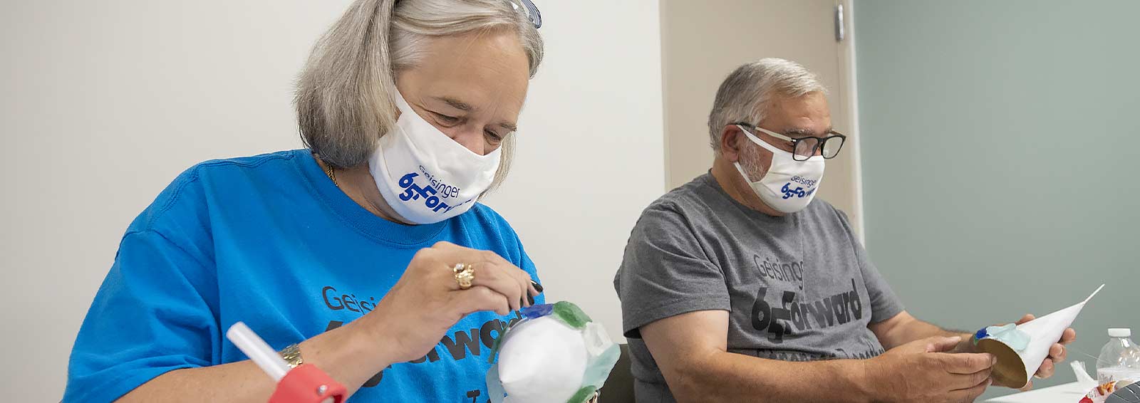 Liz and Rick DeStefano take part in an arts and crafts class at Geisinger 65 Forward in Scranton.