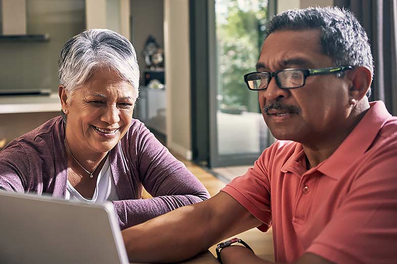Older couple reviewing Medicare options.