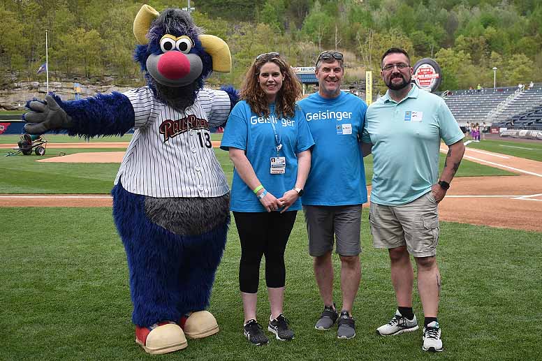 Bariatric surgery patients Elizabeth Royer (second from left) and Bradley Hare (far right) join surgeon Anthony Petrick, MD, and RailRiders mascot Champ at a celebration of the bariatric surgery program’s 20th anniversary. Photo by Kirsten Peters.