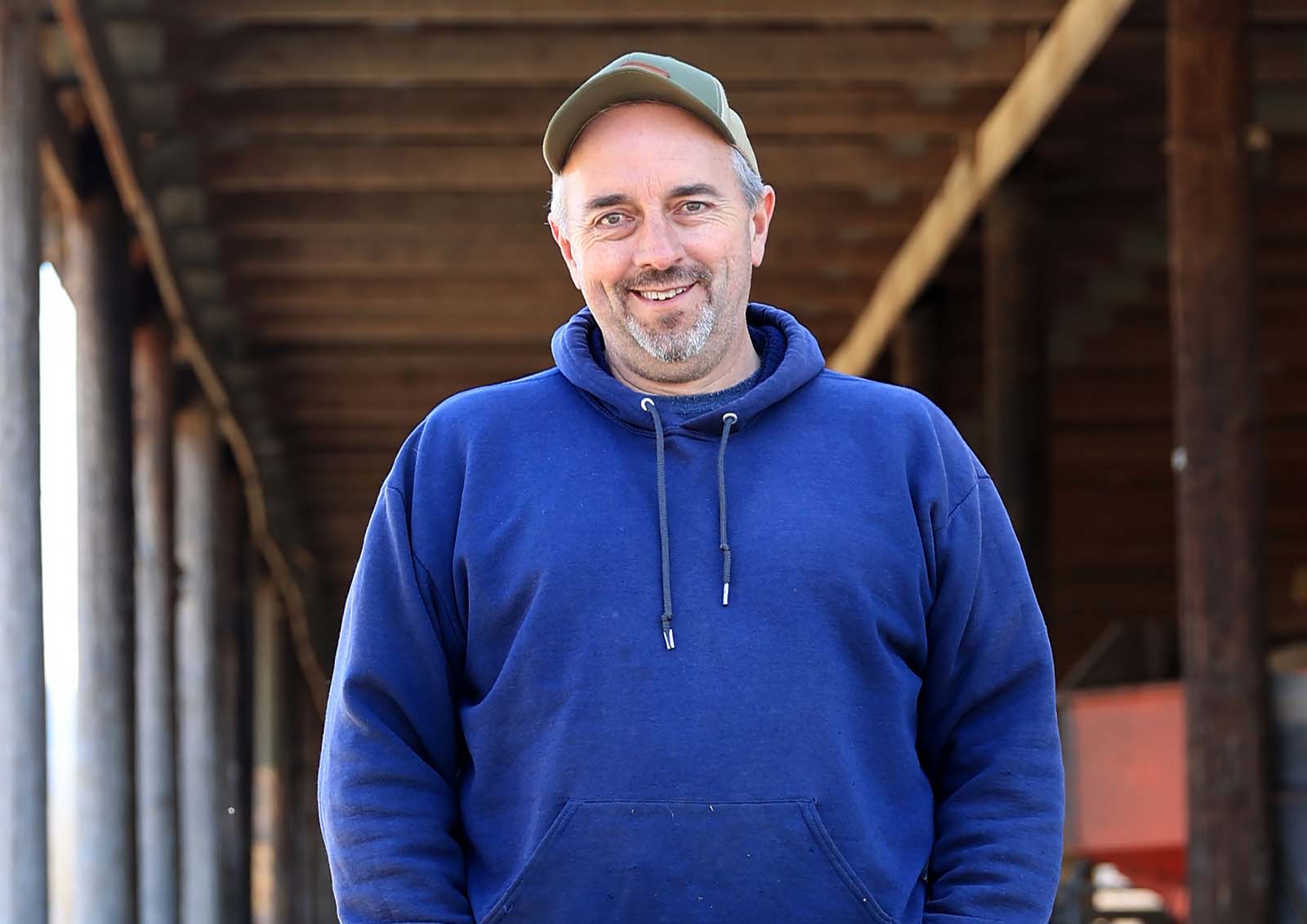 54-year-old farmer, Ben Carson is pictured in his family's barn.