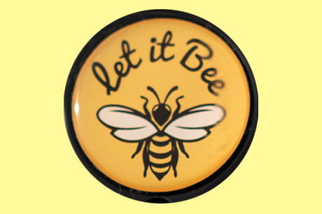 A button depicting the 'let it Bee' motto.