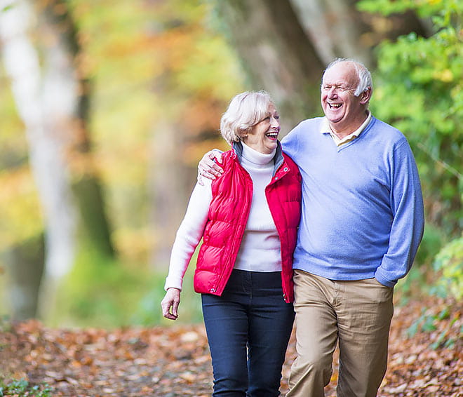 Older couple out on a leisurely walk.