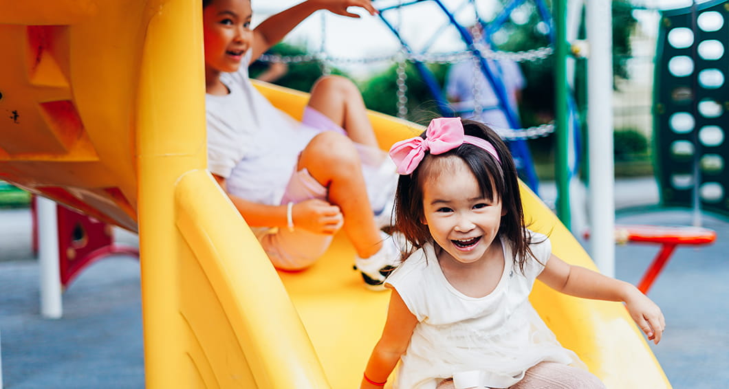 Children paying on a slide